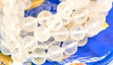 Mala en cristal de quartz transparent Himalaya avec OM (perles de 8 mm)